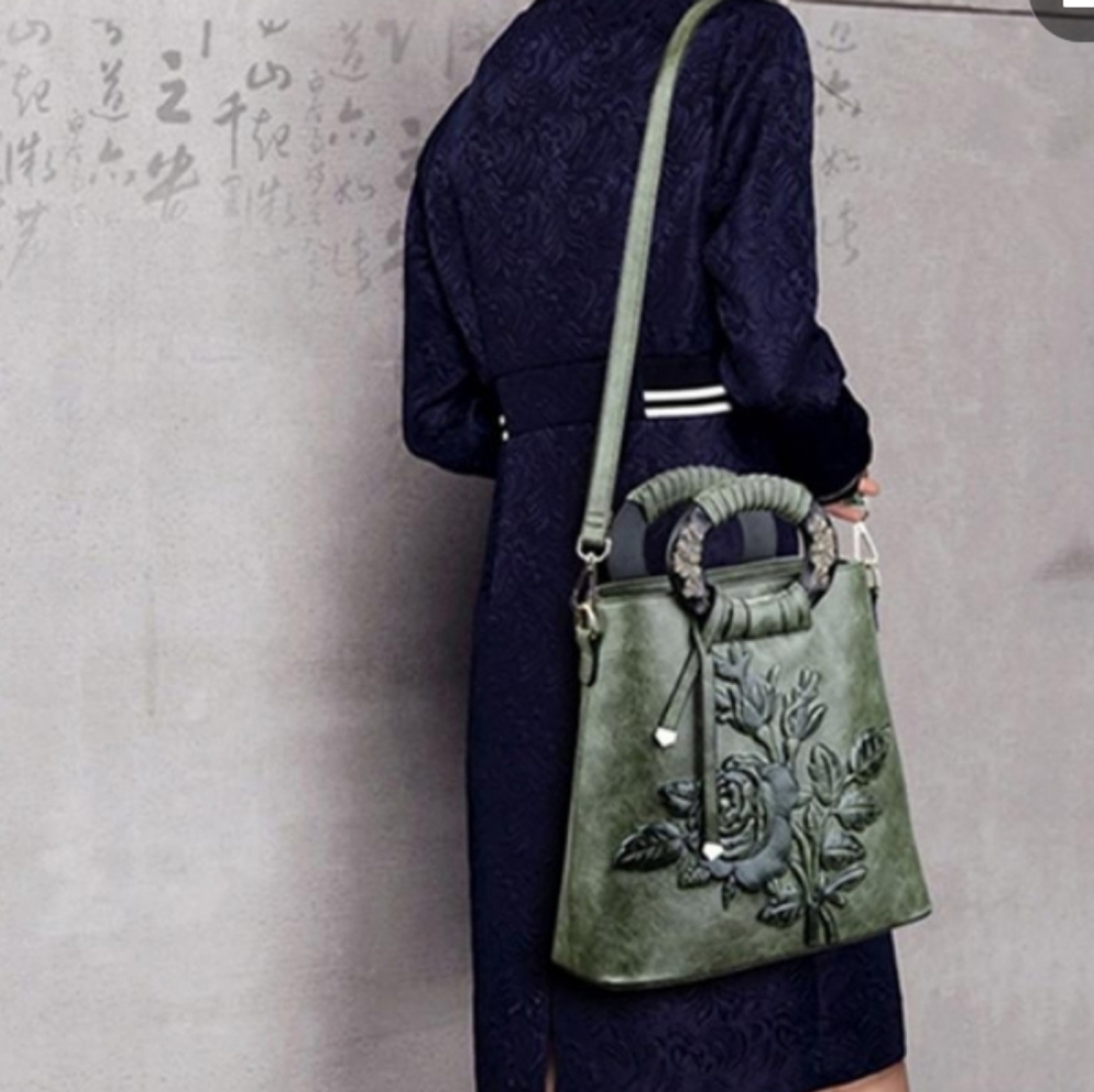 Women's tooled vintage crossbody bag